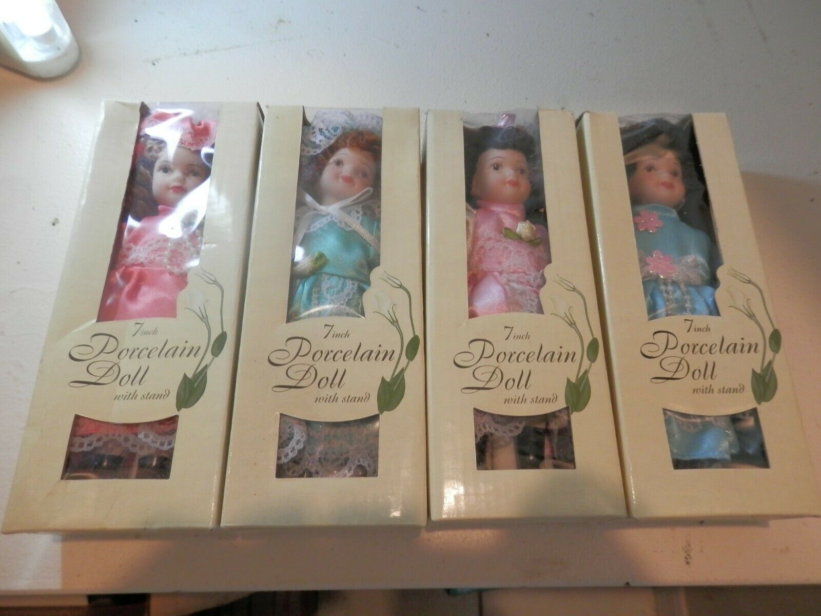 4 Moveable Porcelain Dolls 7 Inch With Stand Still In Box
